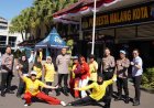 Polresta Malang Kota Bagikan 600 Porsi Makan Gratis, Warga Antusias dan Manfaatkan Layanan Cek Kesehatan Gratis